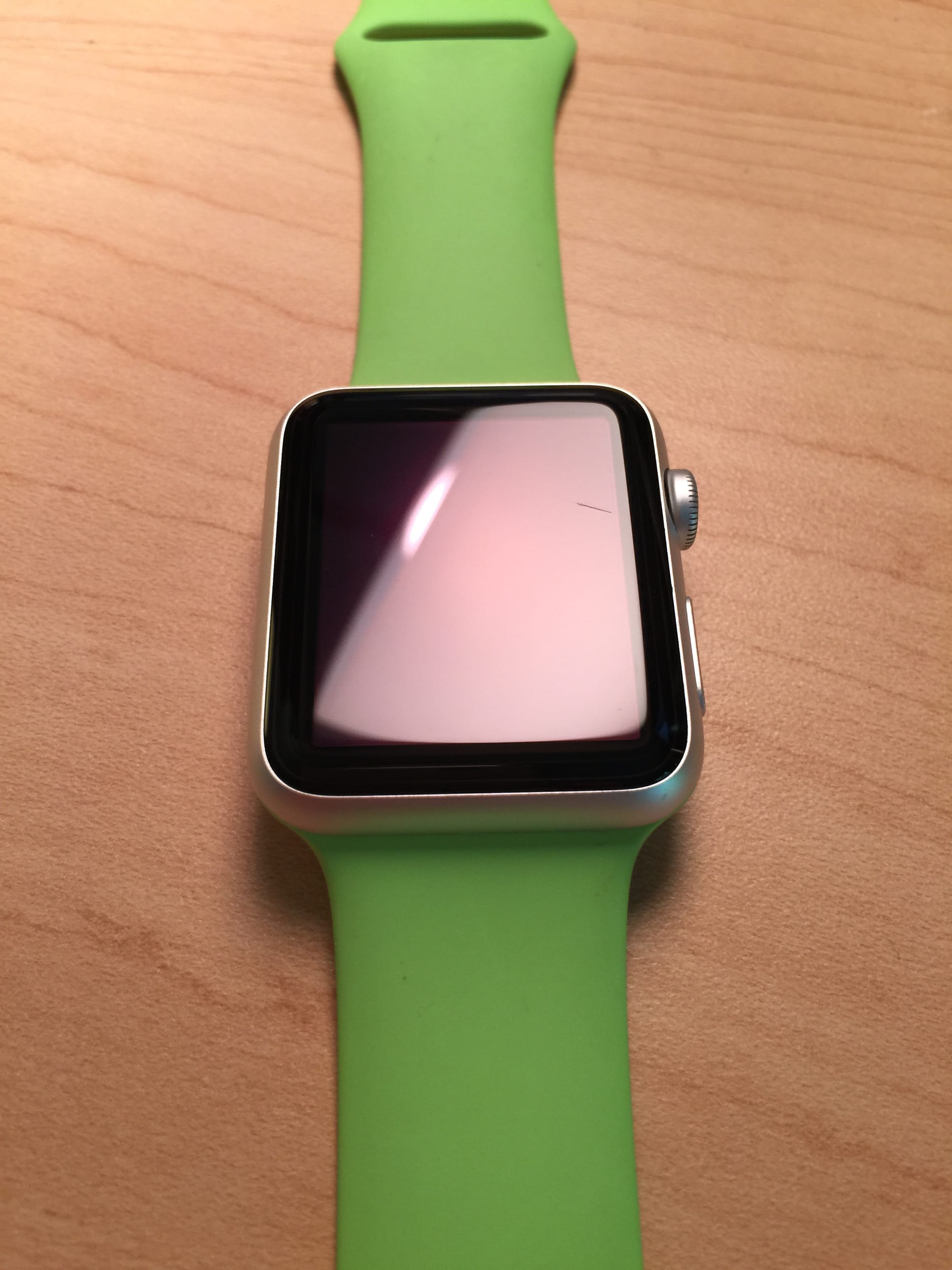 Apple Watch Sport in Green with a scratch in the display
